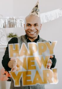 Man with a happy new year sign