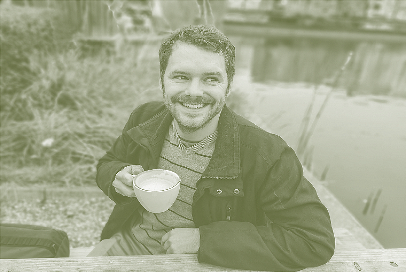 relaxed man drinking a coffee