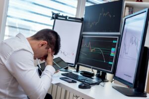 male office worker feeling stressed at work