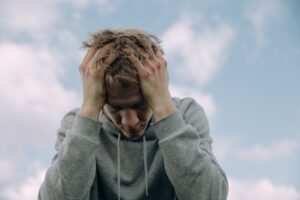 man struggling with unhelpful thoughts