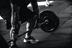 man lifting weights