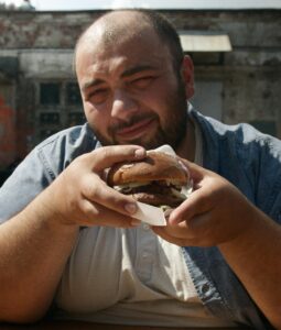 Man eating junk food