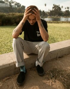 Anxious man with his head in his hands